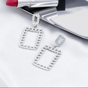 Silvertoned pierced earrings